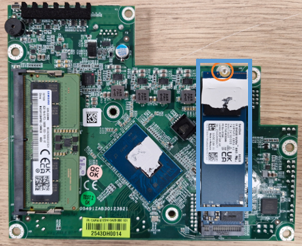 SSD and screw that fastens it to the SNi50 model motherboard